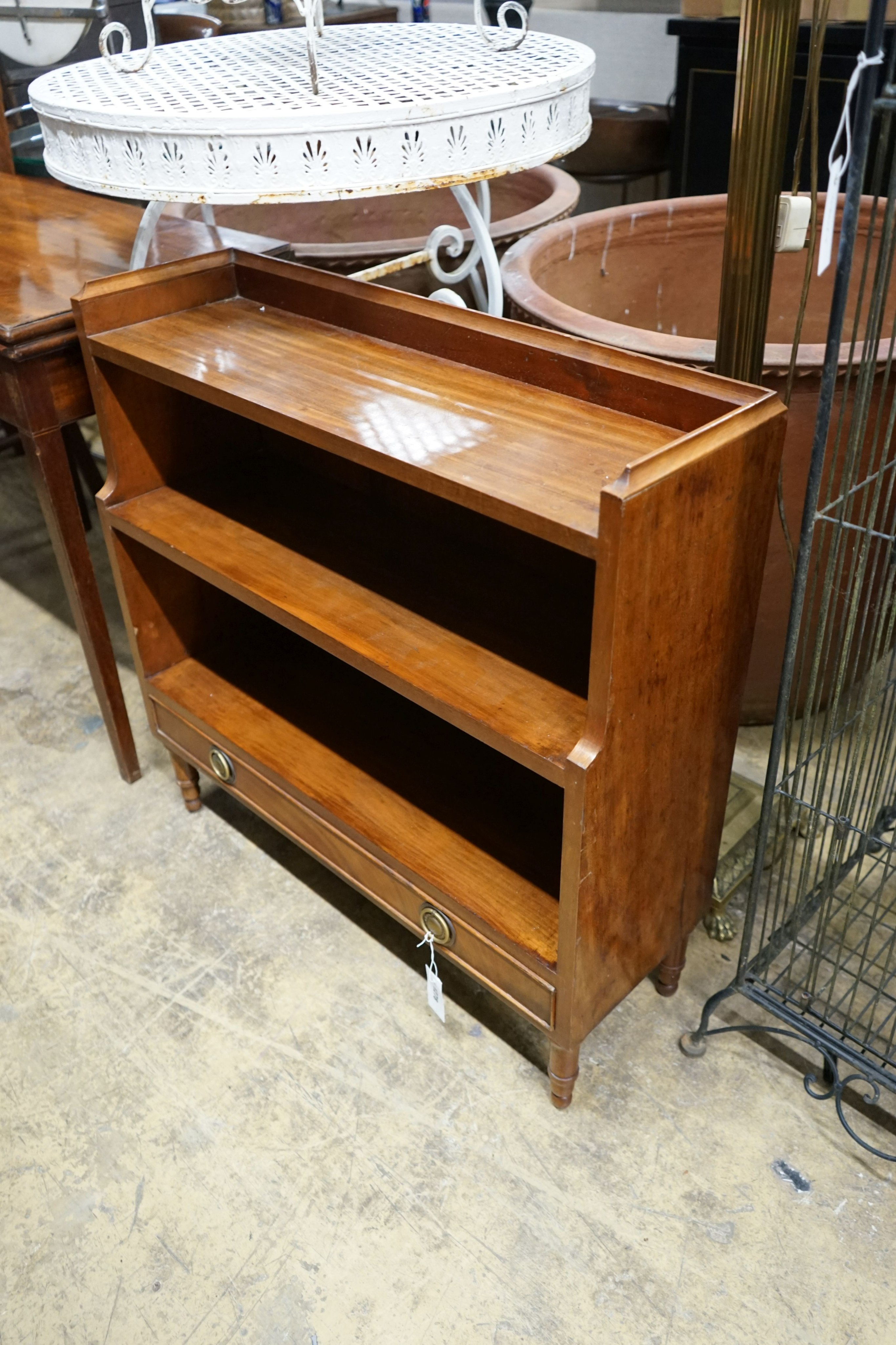 A reproduction Regency style mahogany graduated dwarf open bookcase, width 80 cm, depth 27 cm, height 79 cm.